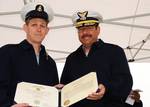 MIDDLETOWN, Calif. - Chief Petty Officer Scott Greenlaw, left, the officer in charge of Coast Guard Loran Station Middletown, Calif. and son of Seguin, Texas natives Charles and Martha Greenlaw, receives a Coast Guard Commendation Medal from Rear Adm. Joseph Castillo, the Eleventh District commander, during the decommissioning ceremony of the facility, May 21, 2010. The loran station began as a radio-based navigation system during World War II under a secret program to provide the Allied forces