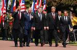 HEADS OF STATE - From left: President Barak Obama, accompanied by Prince Charles of Wales, British Prime Minister Gordon Brown, Canadian Prime Stephen Harper and President of France Nicolas Sarkozy, returns a salute to an honor guard of U.S. and allied servicemembers during the 65th anniversary commemoration of D-Day at the Normandy American Cemetery and Memorial, June 6. The heads of state honored veterans of the D-Day invasion and World War II.