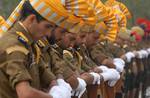 Indian policemen bow their heads in remembrance of fallen colleaguesin Zewan on the outskirts of Srinagar on October 21, 2012. The annual Police Commemoration Day is observed to remember the 5,279 police and security forces killed while fighting separatist militants in the troubled Muslim-majority region during the last 20 years.