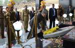 Chief Minister of Indian Kashmir Omar Abdullahlays a floral tribute during a ceremony to mark the Police Commemoration Day at the Police Training Centre in Zewan on the outskirts of Srinagar, the summer capital of Indian Kashmir, 21 October 2012. Police commemoration day is observed in the memory of officers and men of paramilitary forces who laid down their lives in counter-insurgency operations in the country.