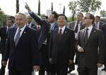 Kazakh President Nursultan Nazarbayev, left, Chinese President Hu Jintao, center, and Russian President Dmitry Medvedev, right, walk sightseeing Tashkent, Uzbekistan, Thursday, June 10, 2010. The leaders arrived in Tashkent to attend a summit of the Shanghai Cooperation Organization. (AP Photo/RIA Novosti, Vladimir Rodionov, Presidential Press Service)