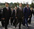 Chinese President Hu Jintao, left, Russian President Dmitry Medvedev, center, and Tajik President Emomali Rakhmon, right, walk sightseeing Tashkent, Uzbekistan, Thursday, June 10, 2010. The leaders arrived in Tashkent to attend a summit of the Shanghai Cooperation Organization. (AP Photo/RIA Novosti, Vladimir Rodionov, Presidential Press Service)