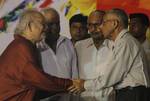 West Bengal Governor M.K Narayan shake hand with Bengali Famous Writer Buddhadeb Guha during the Foundation day of East Bengal Club in Kolkata on 01 August 2012