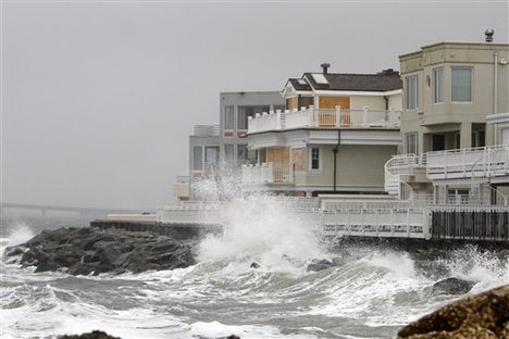 Waves crash onto the sea wall protecting homes in Longport, N.J., Sunday, Oct. 28, 2012, as Hurricane Sandy approaches the area.