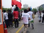 A young man at the relay in Seoul wearing a Daegu University shirt with the phrase 