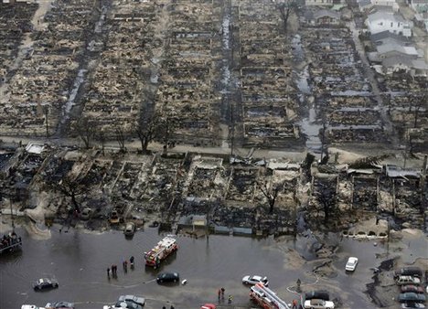 This aerial photo shows burned-out homes in the Breezy Point section of the Queens borough New York after a fire on Tuesday, Oct. 30, 2012.