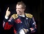 Toro Rosso driver Sebastian Vettel, of Germany, celebrates after clinching the pole position in the qualifying session for Sunday's Formula One Grand Prix in Monza, Italy, Saturday, Sept.13, 2008. Sebastian Vettel became the youngest F1 driver to start from pole position after the Toro Rosso driver was fastest Saturday in a rain-affected qualifying session for the Italian Grand Prix.