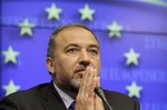 Israel's Foreign minister Avigdor Lieberman attends a media briefing at the ned of an EU-Israel Association Council at the European Council building in Brussels. Lieberman sent a letter to international Mideast peace mediators calling Abbas an "obstacle to peace." He wants them to push for Palestinian elections to choose a new leader.