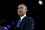 President Barack Obama pauses as he speaks at the election night party at McCormick Place, Wednesday, Nov. 7, 2012