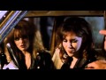 Harvey Keitel gives two girls a warning in 