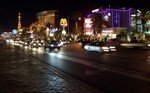 Las Vegas Strip at night with the Aladdin (Now Planet Hollywood). The opening of The Mirage in 1989 set a new level to the Las Vegas experience, as smaller hotels and casinos made way for the larger mega-resorts.