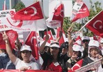 Thousands of Turks demonstrate to condemn terrorism and Kurdish rebels in Ankara, Turkey, Sunday, Sept. 2, 2012. Mostly nationalist Turks shouted: "We don't want The PKK (Kurdistan Workers Party) at the parliament."