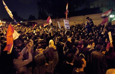 Egyptian protesters chant anti Muslim Brotherhood slogans during a demonstration in front of the presidential palace in Cairo, Egypt, Tuesday, Dec. 4, 2012.