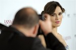 Keira Knightley, a cast member in "Anna Karenina," poses for a photographer at the premiere of the film at The Arclight Hollywood, Wednesday, Nov. 14, 2012, in Los Angeles. (Photo by Chris Pizzello/Invision/AP)