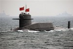 A Chinese Navy nuclear-powered submarine sails during an international fleet review to celebrate the 60th anniversary of the founding of People's Liberation Army Navy Thursday, April 23, 2009 off Qingdao, China's Shandong Province. China on Thursday displayed for the first time its nuclear-powered submarines, a sign of the navy's growing confidence and its aspirations to become a major sea pow