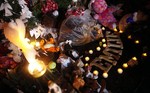 A victim's name is spelled out in wooden letters at a memorial to shooting victims, Monday, Dec. 17, 2012, in Newtown, Conn. A gunman walked into Sandy Hook Elementary School in Newtown Friday and opened fire, killing 26 people, including 20 children.