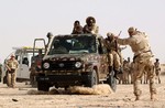 Soldiers from the 1st Battalion, 10th Special Forces Group (Airborne) teach mounted infantry tactics to soldiers from the Malian Army in Timbuktu, Mali. U.S. Army Special Forces, assigned to Special Operations Command Europe, are training selected military units in Mali and Mauritania on mobility, communications, land navigation, and small unit tactics.