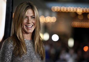 Jennifer Aniston arrives at the premiere of "Love Happens" in Los Angeles on Tuesday, Sept. 15, 2009.