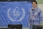 Japan's new Prime Minister Shinzo Abe speaks to Tokyo Electric Power Co. (TEPCO) employees at the emergency operation center in the building used as crisis management headquarters at the Fukushima Dai-Ichi nuclear power plant in Okuma town, Fukushima prefecture, northeastern Japan, Saturday, Dec. 29, 2012.