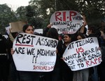 Students hold the poster to  take part in a protest rally against Delhi Rape case at Kolkata on Saturday 22 December 2012