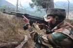 Indian Army soldiers patrol outside their army camp at Gurez, about 180 kilometers (113 miles) north of Srinagar, India, Saturday, Aug. 20, 2011. Indian troops in Kashmir fought a deadly gunbattle with suspected rebels crossing the military Line of Control from Pakistani-controlled territory Saturday, the army said. One soldier and 11 suspected rebels were killed, army spokesman Lt. Col. J.S. Brar said, but only six suspected rebels' bodies were recovered. He said the other five bodies were lost when they fell into a river during the fighting in the disputed Himalayan region.