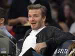 Soccer player David Beckham watches the Los Angeles Lakers play the Orlando Magic NBA basketball game, Sunday, Dec. 2, 2012, in Los Angeles. The Magic won 113-103.