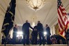 CIA Director-nominee Deputy National Security Adviser for Homeland Security and Counterterrorism, John Brennan, second from left, shakes hands with the president's choice for Defense Secretary, former Nebraska Sen. Chuck Hagel, second from right, as the president, center, speaks in the East Room of the White House in Washington, Monday, Jan. 7, 2013, where he made to announcement. At left is Acting CIA Director Michael Morell, at right is current Defense Secretary Leon Panetta.