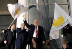 Demetris Christofias, head of the reformed communist AKEL party waves to his supporters outside of his campaign headquarters in capital Nicosia, Cyprus, Sunday Feb. 17, 2008. President Tassos Papadopoulos was eliminated from Cyprus' presidential runoff in a major surprise after a cliffhanger election that saw three candidates neck-and-neck until the last minute. Communist party leader Demetris Christofias, and former Foreign Minister Ioannis Kasoulides of the right-wing DISY party will now vie for the five-year presidency in next Sunday's runoff. 