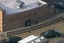 File - Police arrive at Sandy Hook Elementary, after the shooting on December 14, 2012.