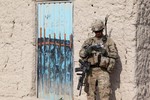 U.S. Army Sgt. Keith Keller, a combat engineer assigned to 3rd Platoon, Alpha Company, 3rd Special Troops Battalion, 3rd Brigade Combat Team "Rakkasans", 101st Airborne Division (Air Assault), Task Force 3/101, consults a map to determine the best route to the next objective during a patrol through a village in Khowst Province, Afghanistan, Jan. 12, 2013.