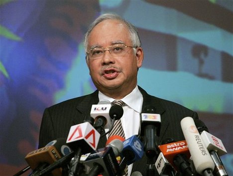 Malaysian Prime Minister Najib Razak speaks to media during a press conference as he unveiled a new Cabinet in Putrajaya, outside Kuala Lumpur, Malaysia, Thursday, April 9, 2009.