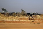 Two French fighter jets are seen at Bamako's airport Tuesday Jan. 15, 2013. French forces led an all-night aerial bombing campaign Tuesday to wrest control of a small Malian town from armed Islamist extremists who seized the area, including its strategic military camp.