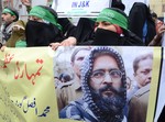 Activists of the Jammu and Kashmir Mass Movement (JKMM) shouting anti-India slogans during a protest in support of clemency for Mohammad Afzal Guru in Srinagar on December 13, 2012. Indian police detained some half a dozen activists during the protest. Fellow Kashmiri, Mohammad Afzal Guru was sentenced to death by an Indian court after being found guilty of being involved in the 13 September 2001 attack on India's Parliament House in New Delhi. The protestors appealed to the President to commute the death sentence of Guru and reinvestigate the case.