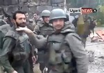 This image taken from video obtained from Ugarit News on Thursday, Feb. 7, 2013, which has been authenticated based on its contents and other AP reporting, purports to show Syrian soldiers dancing to Usher's hit song "Yeah!"