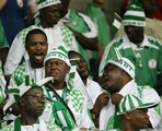 Nigeria supporters root for their team as it plays Costa Rica during the FIFA U20 World Cup soccer tournament in Victoria, Canada, Sunday, July 1, 2007. Decked out in green-and-white striped toques and matching T-shirts, 90 members of the Nigeria Football Supporters' Club followed their men's youth team all the way from western Africa to Victoria for the tournament.