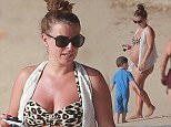 Animal magic maternity wear: Pregnant Coleen Rooney shows off her baby bump in leopard print bikini 