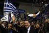 Right-wing presidential candidate Nicos Anastasiades waves to his supporters during a rally in capital Nicosia, Cyprus, Wednesday, Feb. 13, 2013.