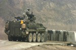 File - U.S. Army Soldiers aboard an M1126 Stryker Infantry Carrier Vehicle from Alpha Company, 1st Battalion, 27th Infantry Regiment prepare to fire its .50-caliber heavy machine gun during live-fire exercises at Rodriguez Range Complex, South Korea, as part of exercise Reception, Staging, Onward movement, and Integration / Foal Eagle 2007 March 22, 2007.