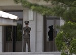 File - A North Korean soldier observes the South at the truce village of Panmunjom in the demilitarized zone (DMZ) that separates the two Koreas since the Korean War, north of Seoul.