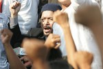 Detained former Muslim rebel chieftain Nur Misuari joins others during celebrations of Eid al-Fitr marking the end of the holy fasting month of Ramadan in suburban Manila on Monday Oct. 23, 2006. 