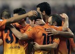 FC Barcelona's Lionel Messi from Argentina, center, celebrates his goal with team mates during a Spanish La Liga soccer match against Deportivo la Coruna at the Riazor stadium in La Coruna, Spain, Saturday, Oct. 20, 2012.