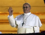 Pope Francis waves to the crowd from the central balcony of St. Peter's Basilica at the Vatican, Wednesday, March 13, 2013.