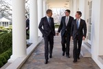 File - President Barack Obama walks along the Colonnade of the White House with Chief of Staff Jack Lew and Treasury Secretary Timothy F. Geithner, Jan. 10, 2013.