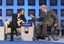 German Finance Minister Wolfgang Schaeuble, right, points to French Finance Minister Francois Baroin, left, during a session at the World Economic Forum in Davos, Switzerland, Friday, Jan. 27, 2012.