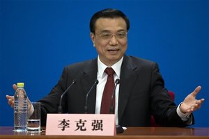 China's newly-named Premier Li Keqiang speaks during a press conference after the closing ceremony of the National People's Congress held in Beijing's Great Hall of the People, China, Sunday, March 17, 2013.