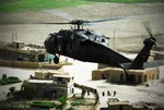 U.S. Army Soldiers from the 350th Tactical Psychological Operations, 10th Mountain Division conduct a leaflet drop in Kirkuk, Iraq, March 27, 2008, to improve relations between citizens and coalition forces.