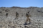 This photo taken March 8, 2013 and released on March 14, 2013, by the French Army Communications Audiovisual office (ECPAD) shows French soldiers patrolling in the Mettatai region in northern Mali.