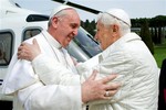 In this photo provided by the Vatican paper L'Osservatore Romano, Pope Francis meets Pope emeritus Benedict XVI in Castel Gandolfo Saturday, March 23, 2013.