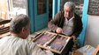 Cypriots play backgammon outside a cafe in the old city of Nicosia