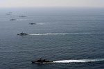 File - U.S. and Republic of Korea Navy ships sail in formation during exercise Foal Eagle 2013.